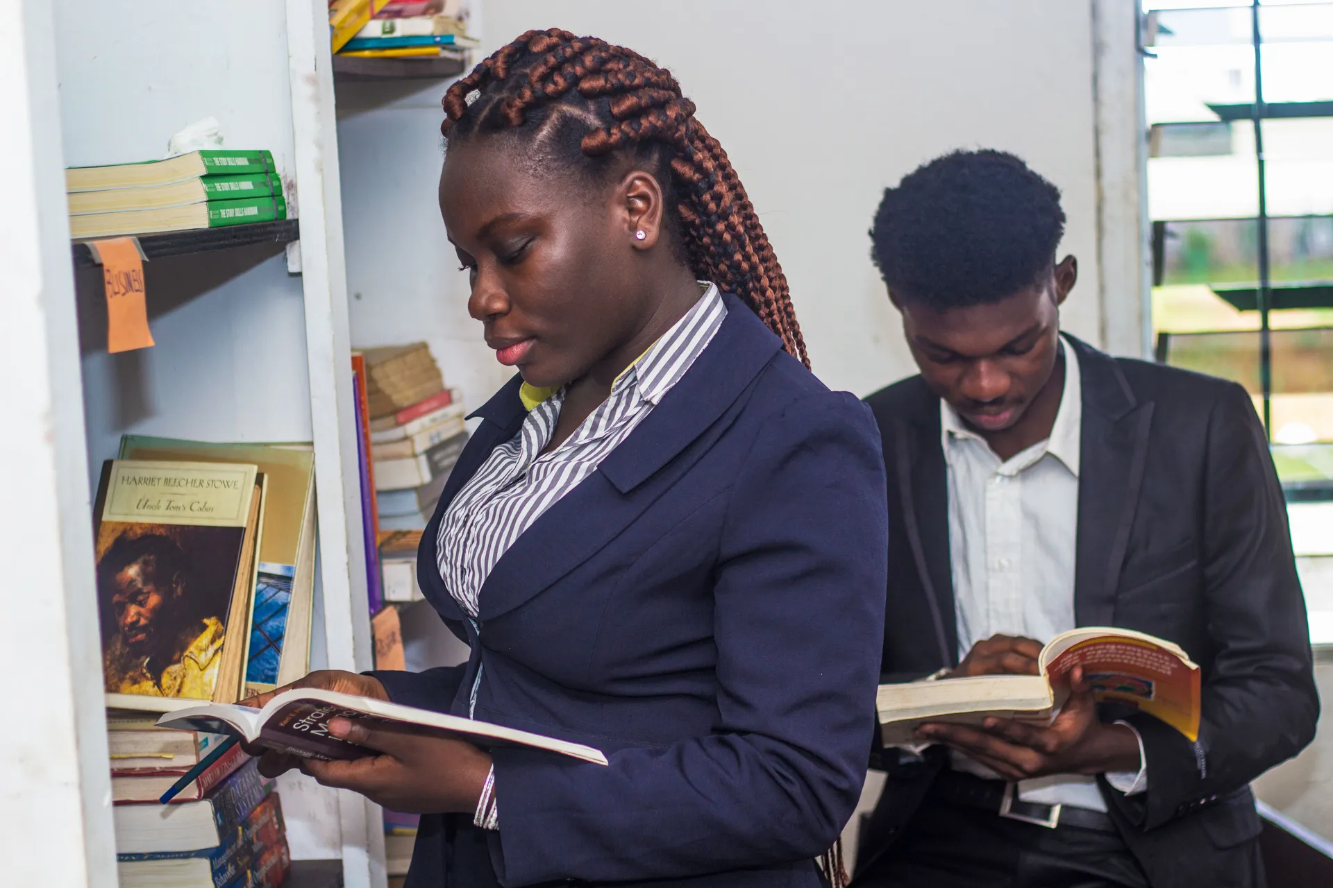 African Vision International University students studying together in a library