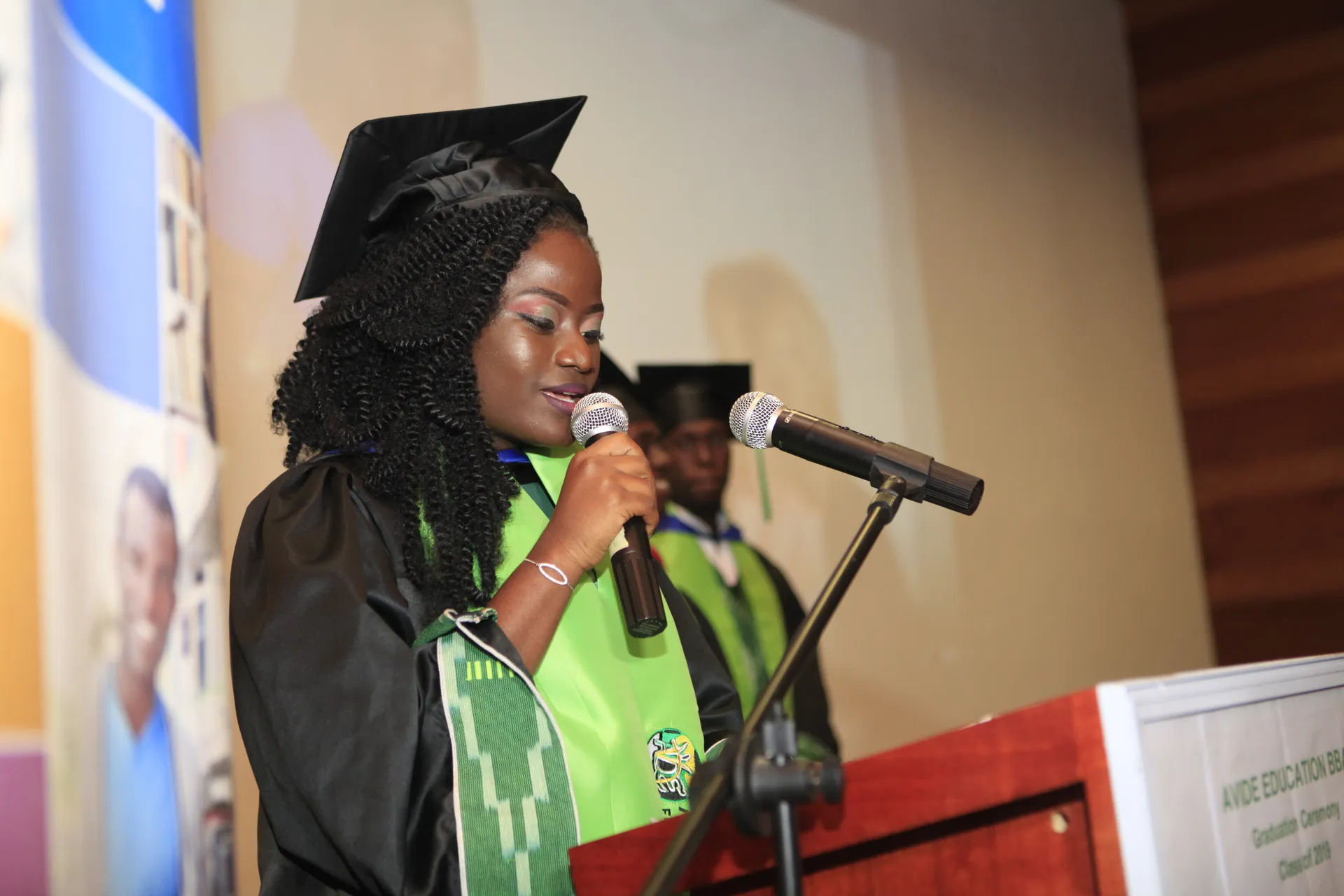 African Vision International University graduate speaking at a ceremony